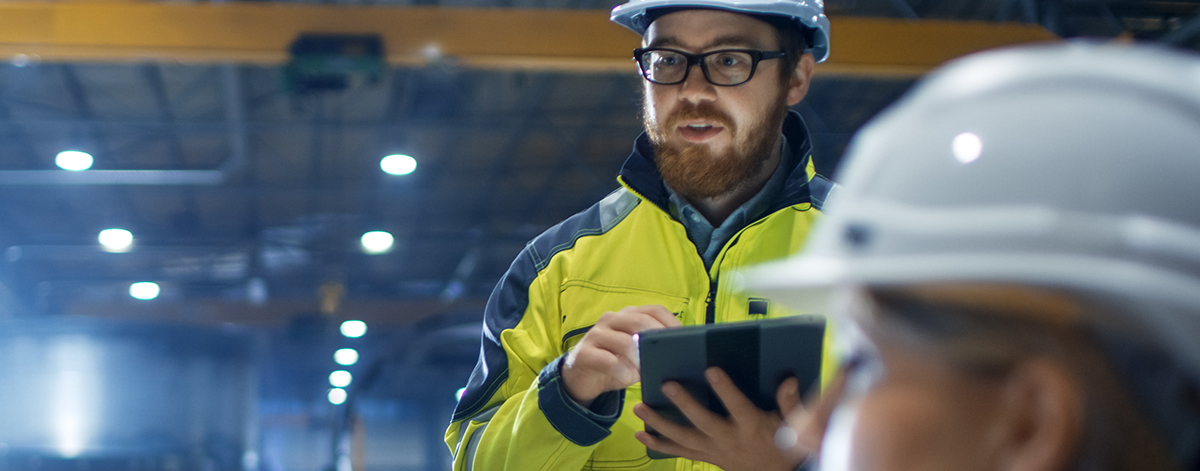 NATA accredited asbestos testing image of a man holding ipad