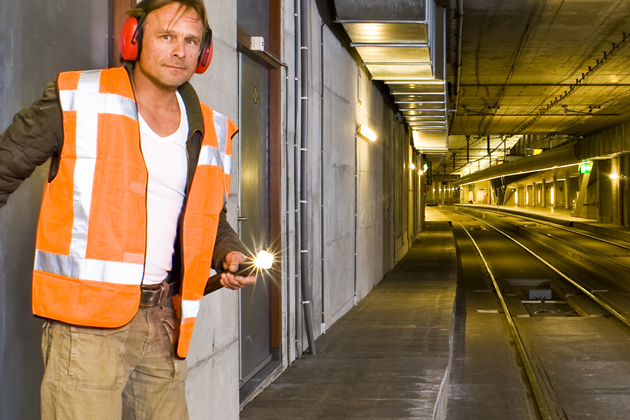 noise monitoring image of a man underground with ear protection 